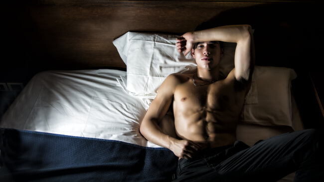 Young man in bed