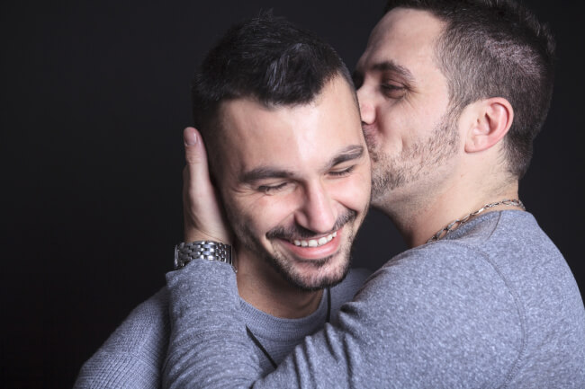 Couple of men kissing