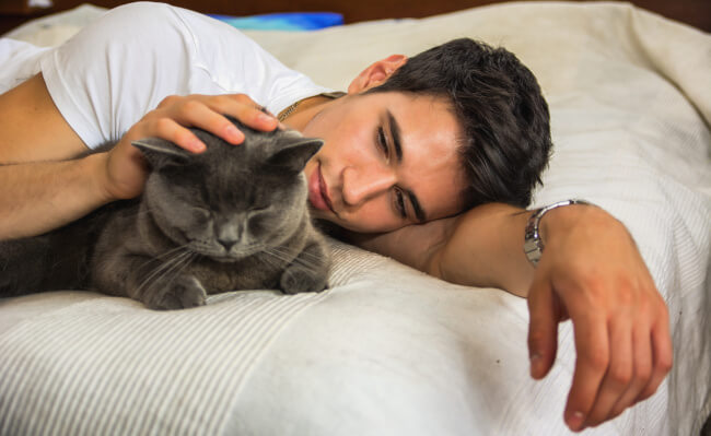 Handsome man with a cat