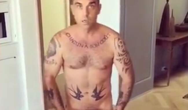 Robbie Williams naked with cake