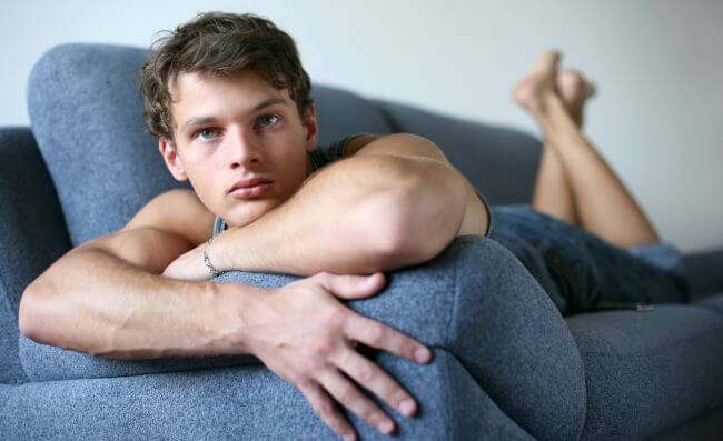 Sexy Young Man on the Sofa