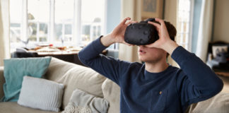 Man with virtual reality headset watching gay porn