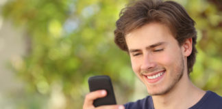 Man looking at this phone