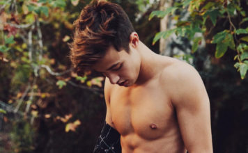 16 Photos That Show Off Cameron Dallas’ Incredible Body Cameron Dallas looking down at this stomach