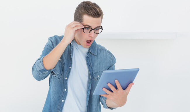 Shocked man with tablet