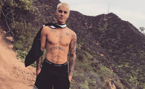 Justin Bieber shirtless with a cape