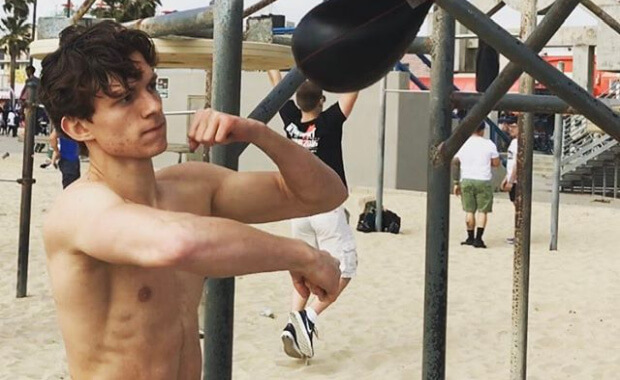 Tom Holland shirtless on the beach