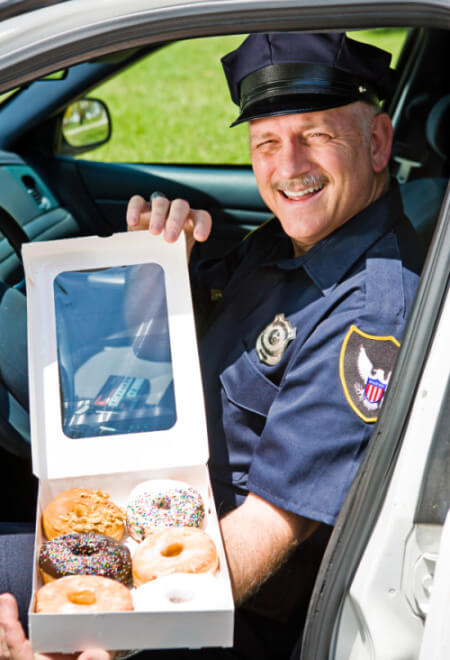 police officer cop with donuts