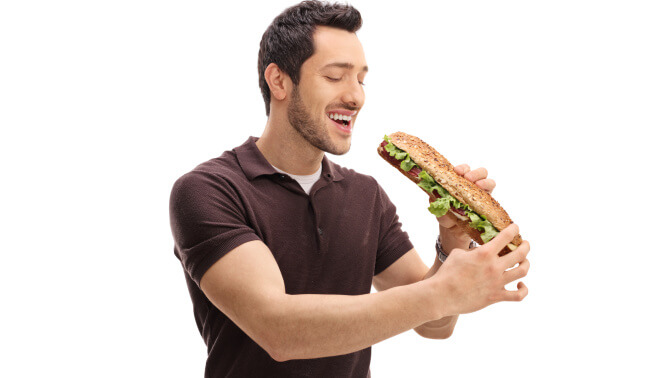 Man eating a big sandwich