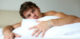 Man in bed with pillow
