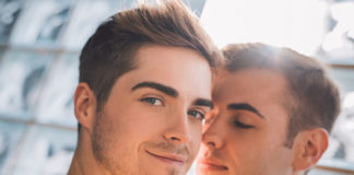 gay couple looking at the camera
