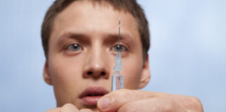 Man with niddle syringe injection