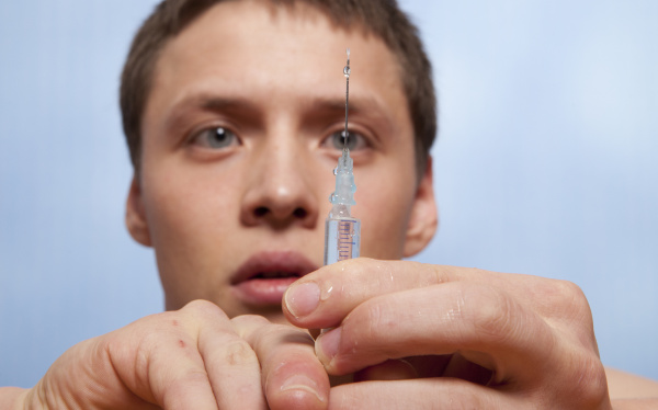 Man with niddle syringe injection