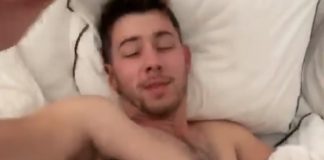 Nick Jonas shirtless in bed